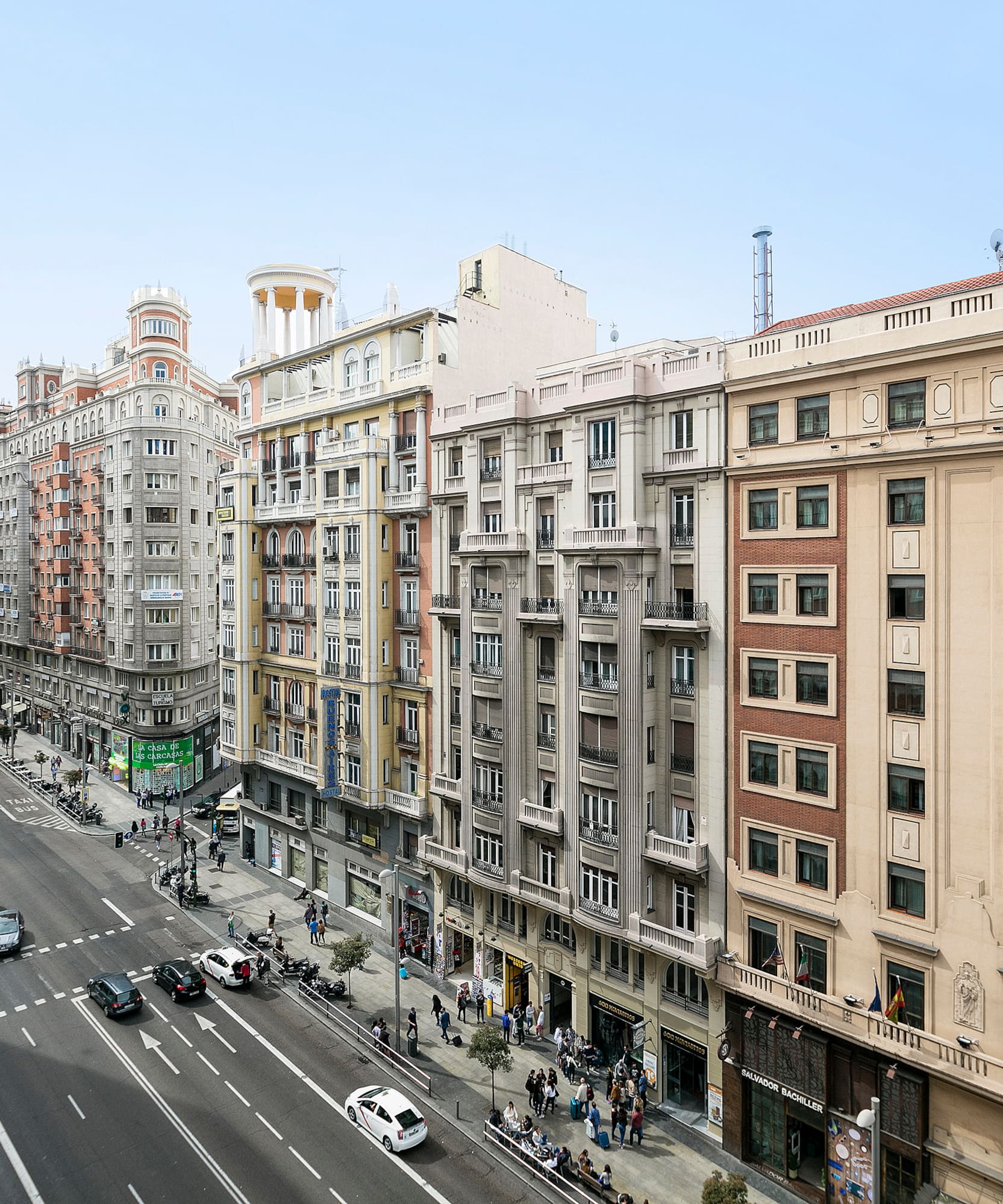 a street with cars and buildings