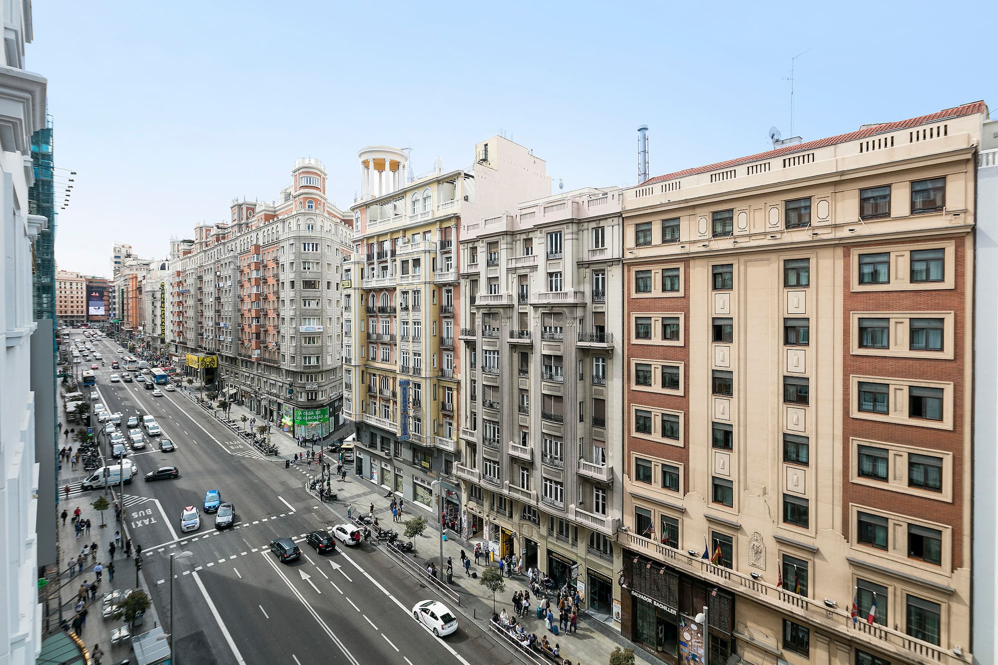 a street with cars and buildings