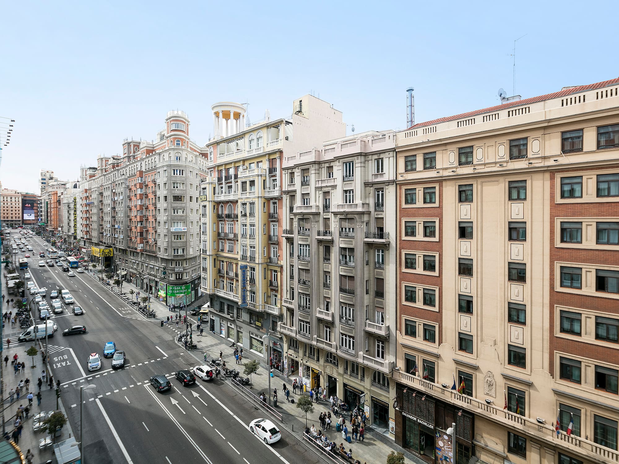 a street with cars and buildings