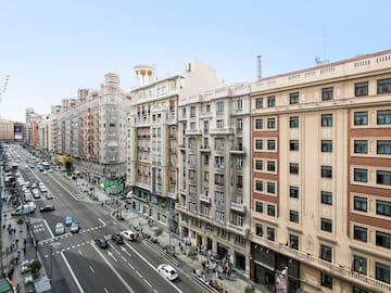 a street with cars and buildings