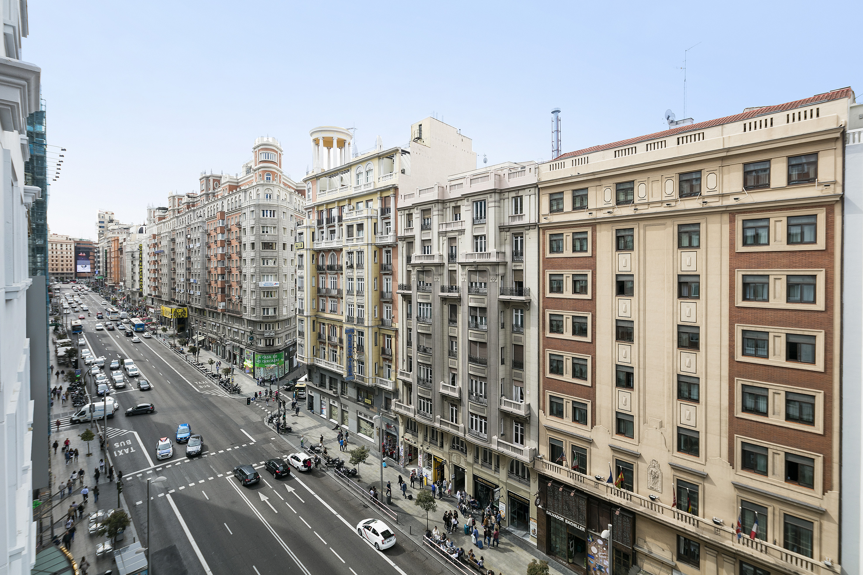 a street with cars and buildings