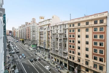 a street with cars and buildings