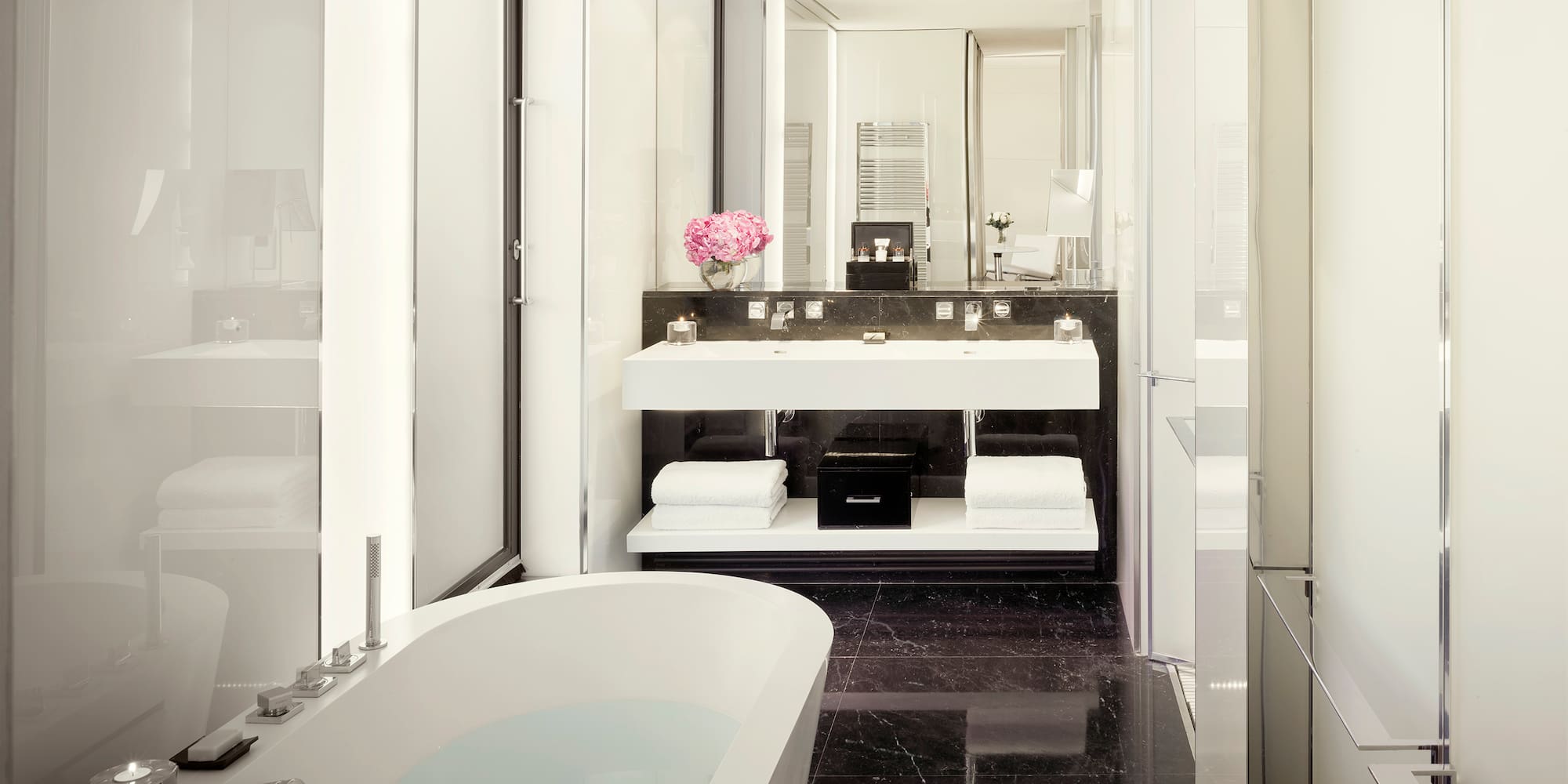 a bathroom with a tub and sink