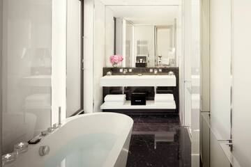 a bathroom with a tub and sink
