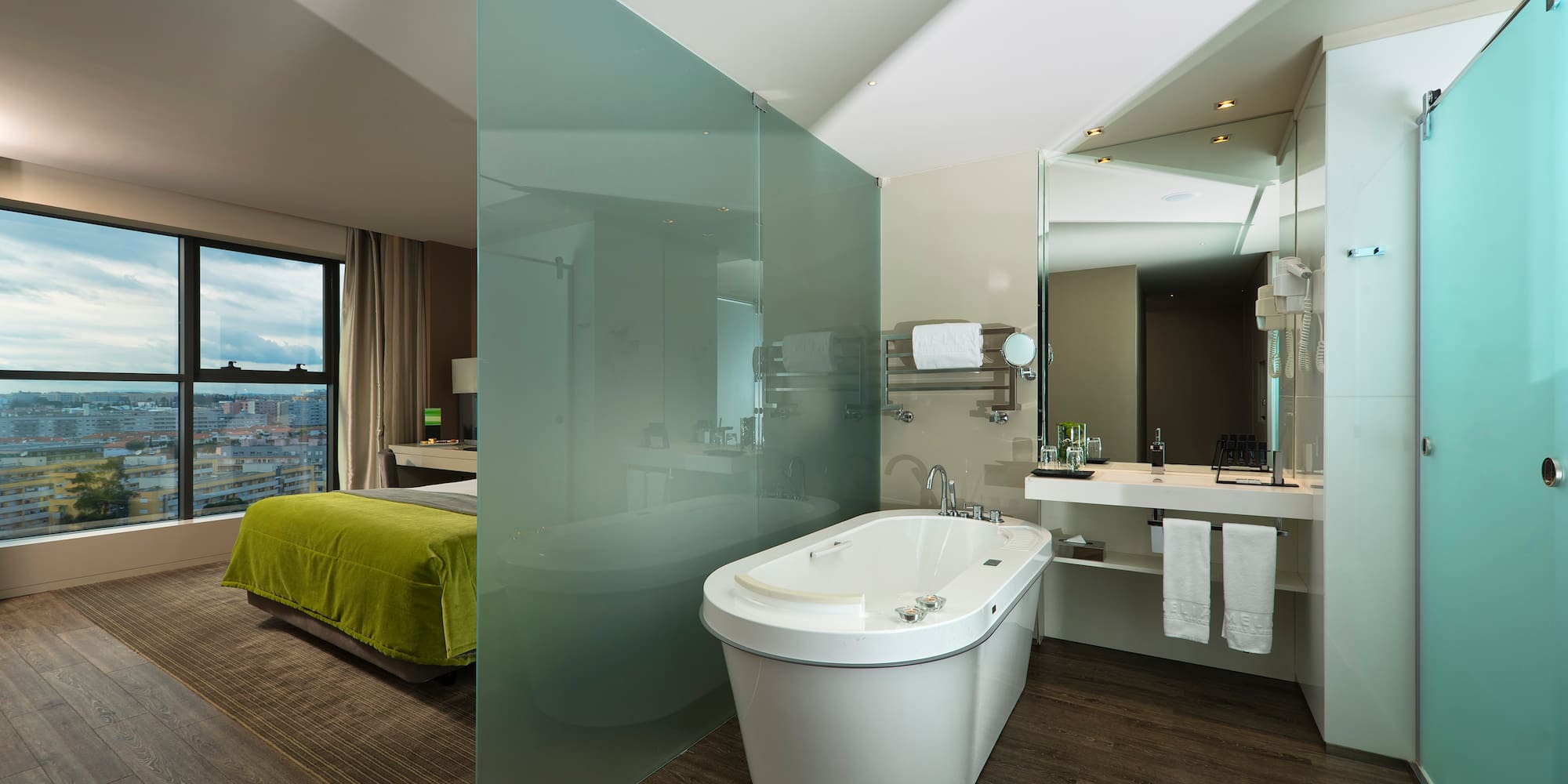 a bathroom with a bathtub and a mirror
