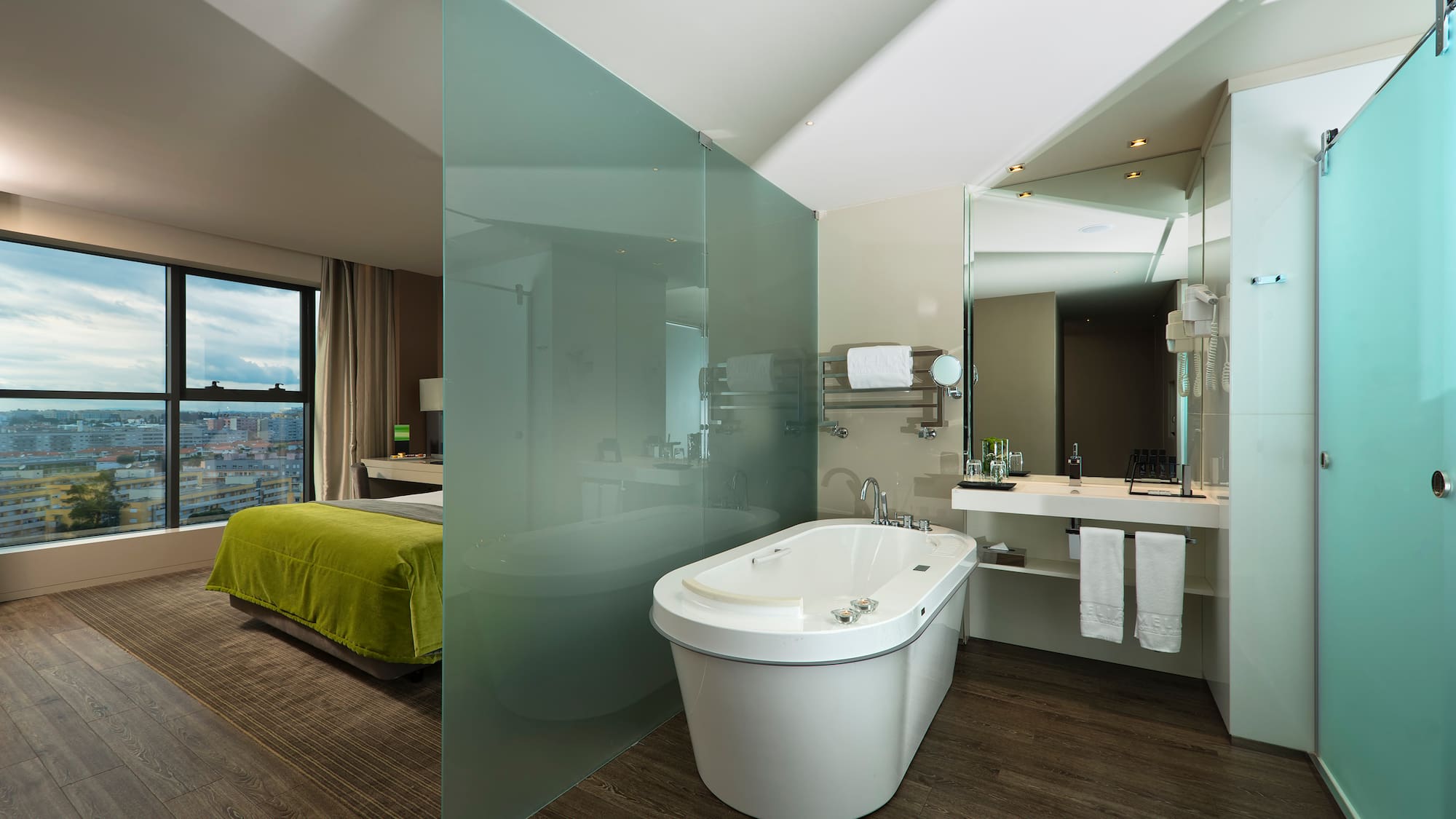 a bathroom with a bathtub and a mirror