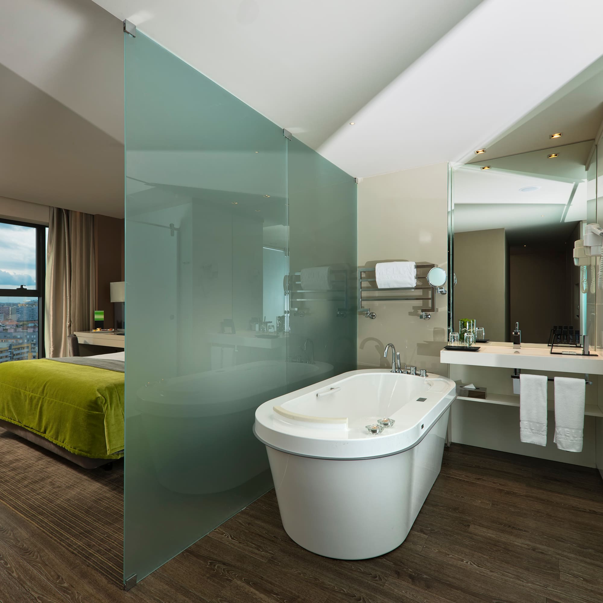 a bathroom with a bathtub and a mirror