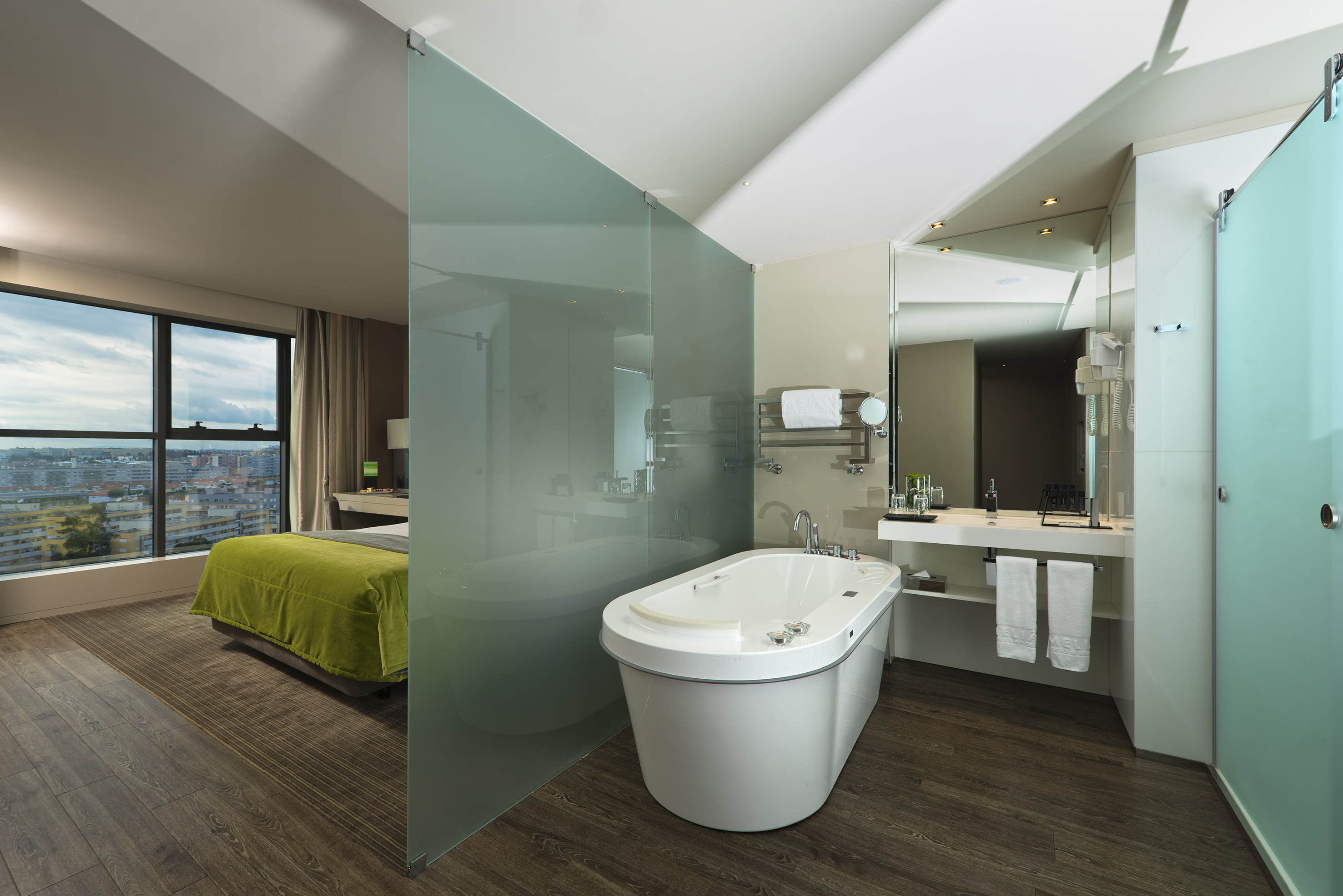 a bathroom with a bathtub and a mirror