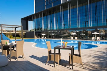 a pool with a table and chairs