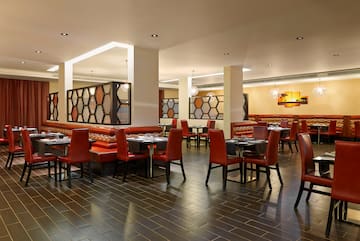 a restaurant with tables and chairs