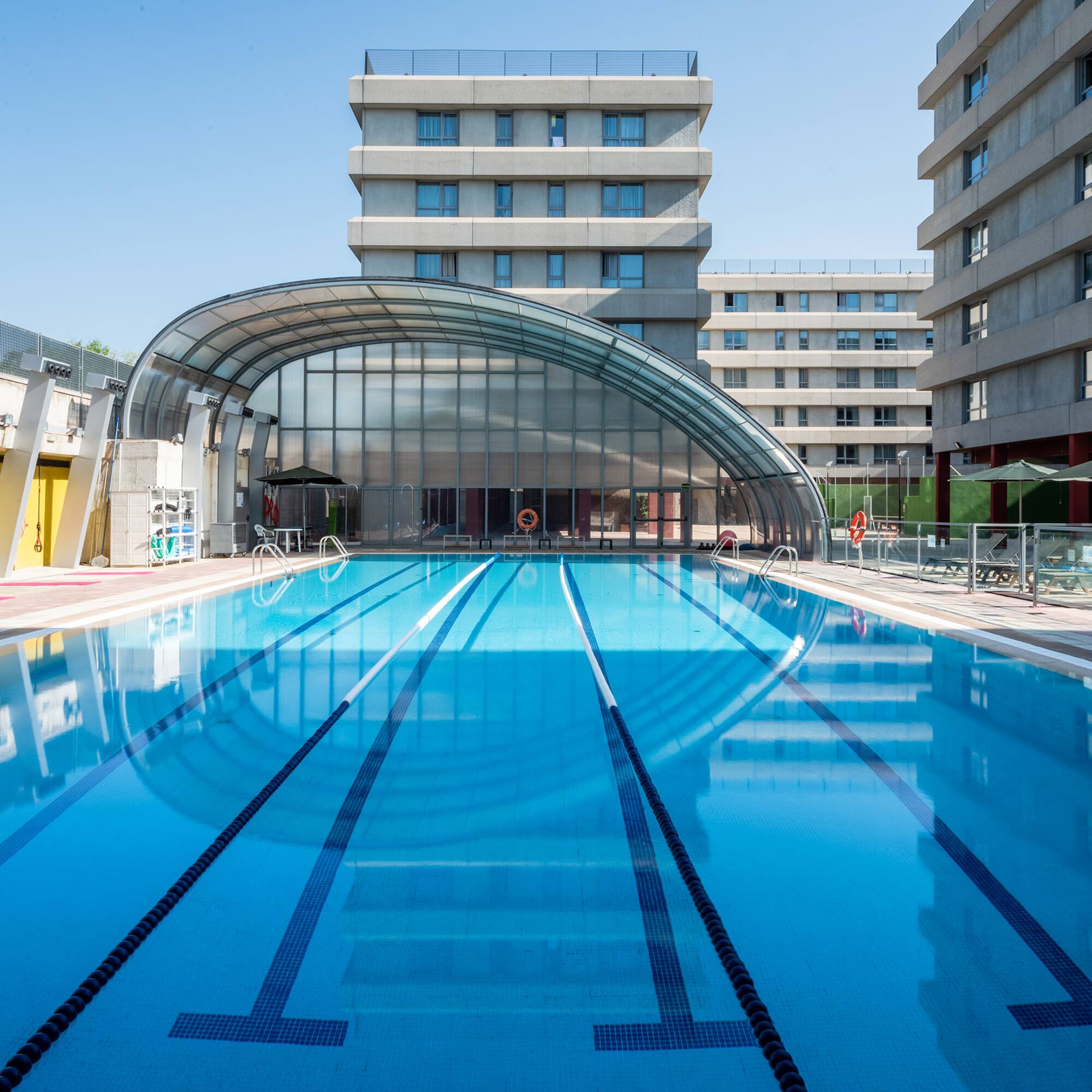 a swimming pool with a roof over it