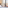 Bedroom with large window, Madrid city view, church spire, and vintage phone.
