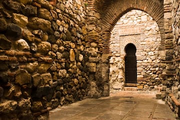 a stone archway with a door
