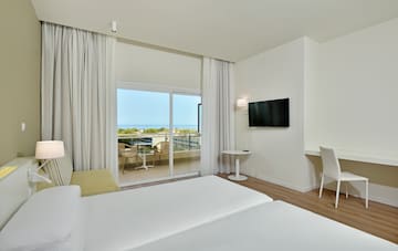 a room with a television and a balcony