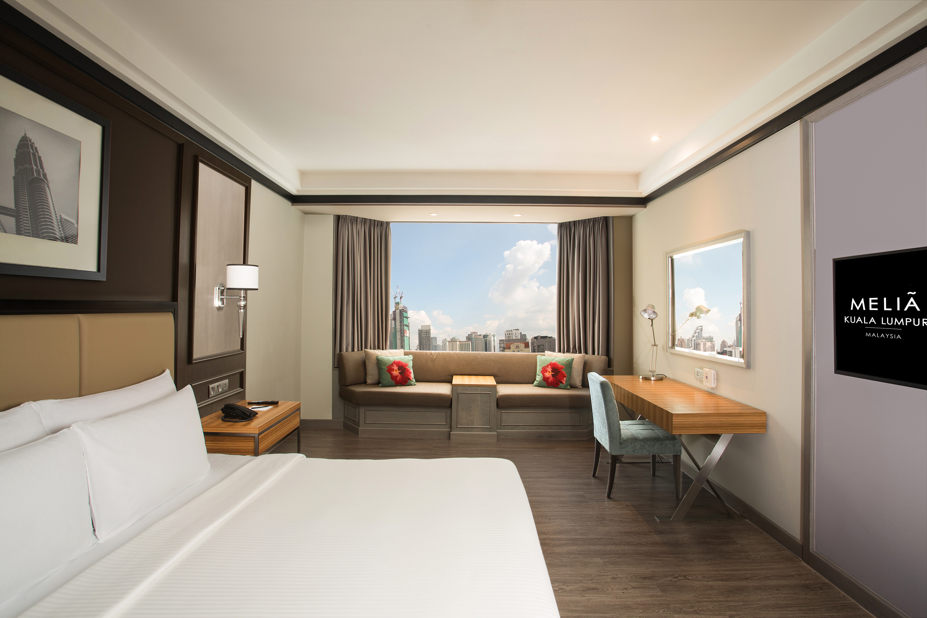 a room with a bed and a desk