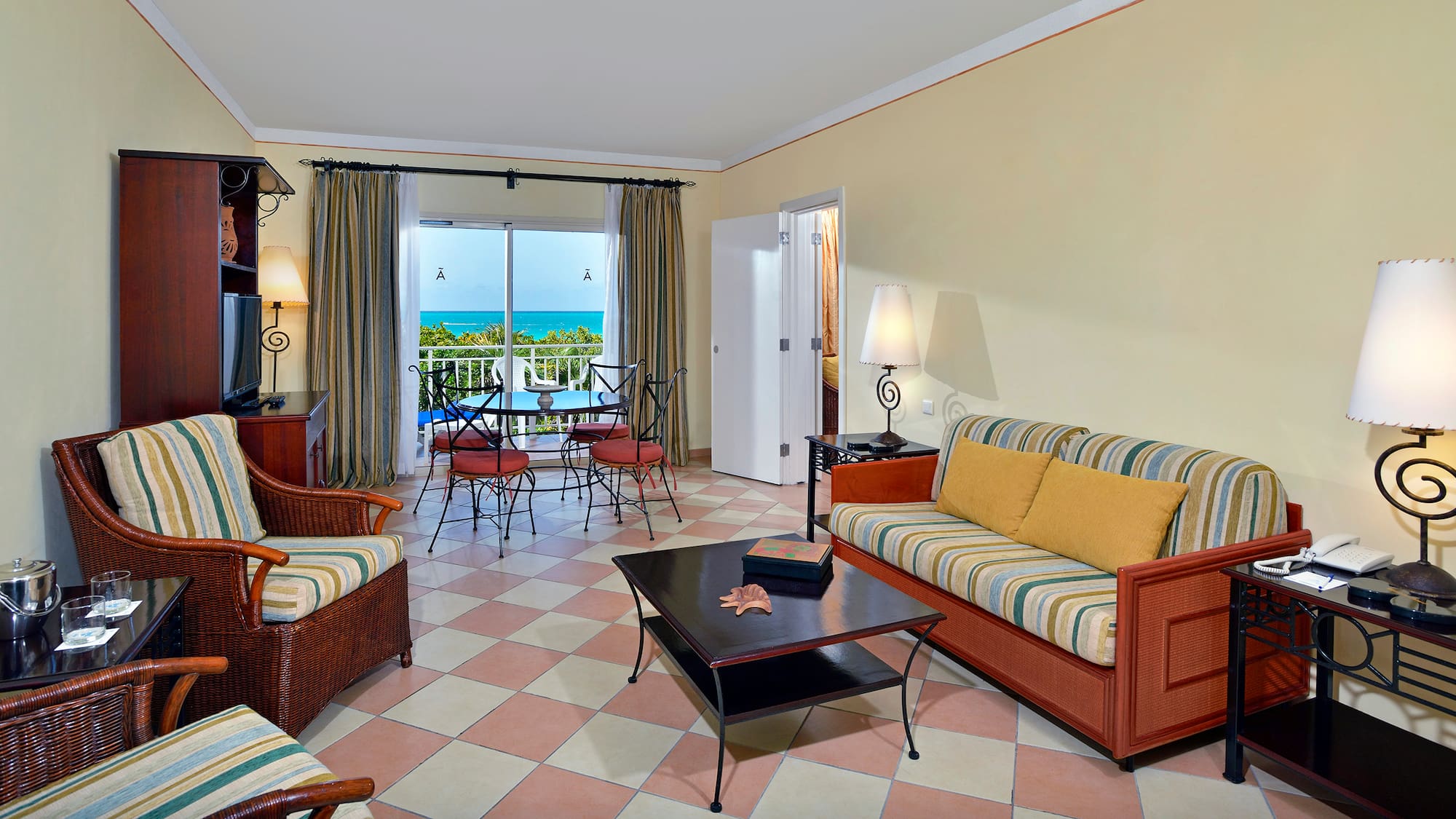 a living room with a table and chairs