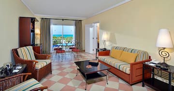 a living room with a table and chairs