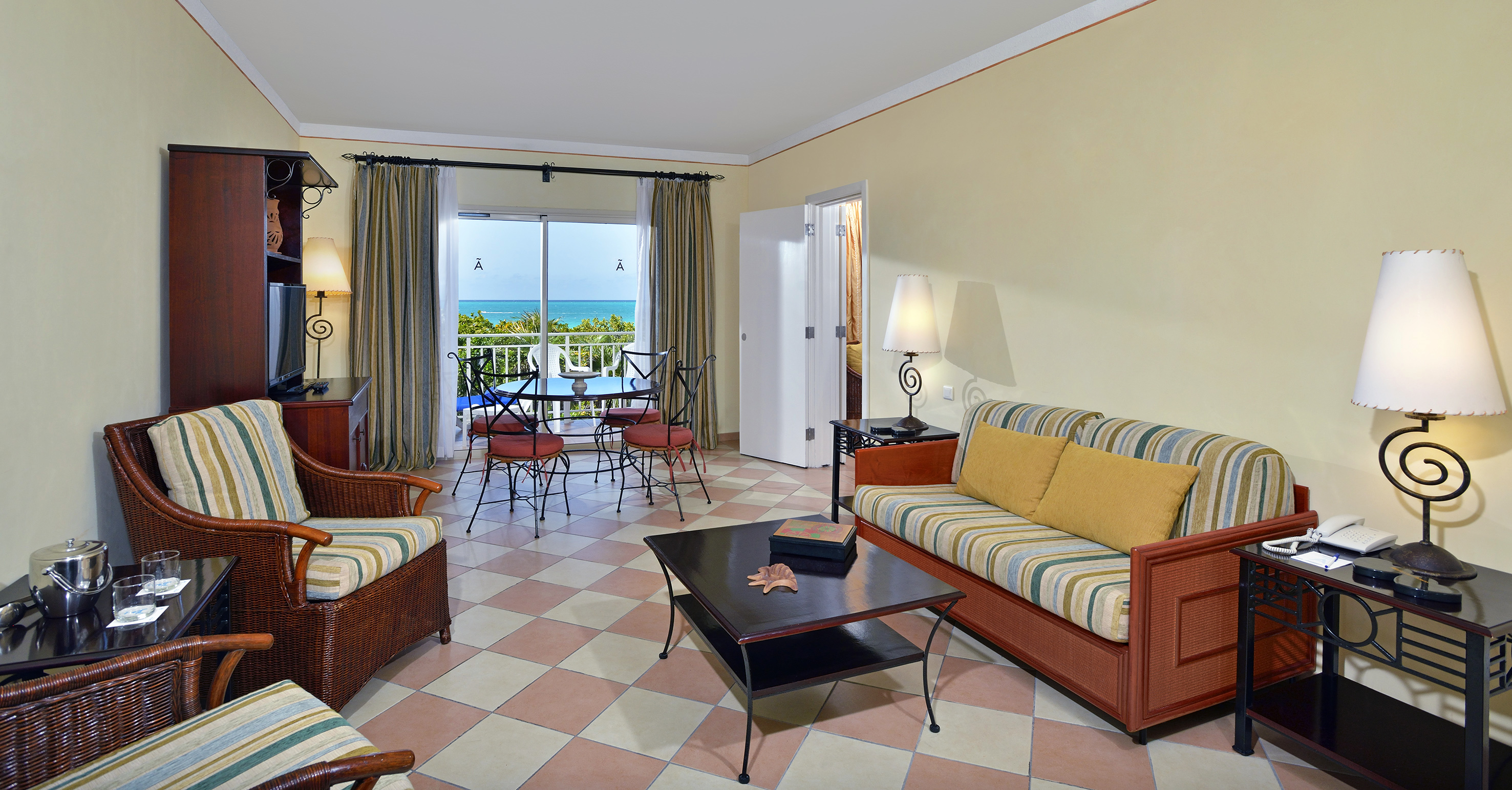 a living room with a table and chairs