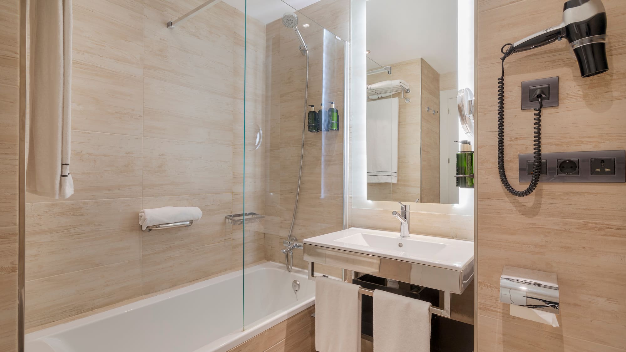 a bathroom with a glass shower door
