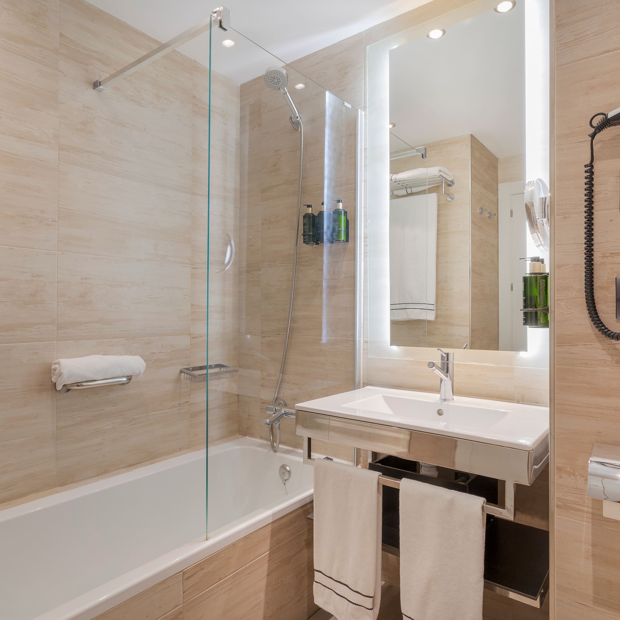 a bathroom with a glass shower door