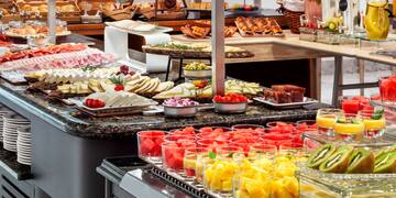 a buffet table with different food items