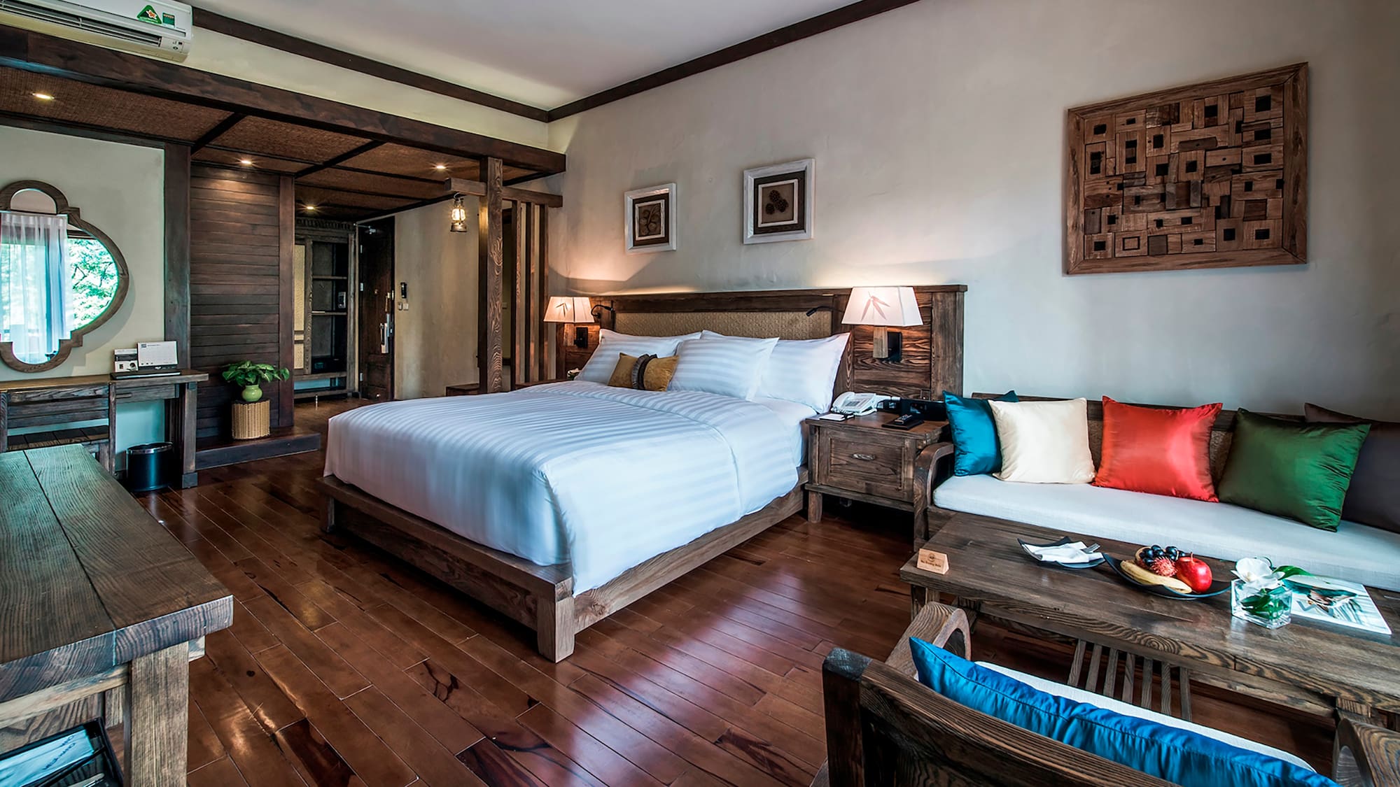 a bedroom with a bed and a table