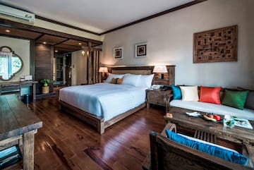 a bedroom with a bed and a table