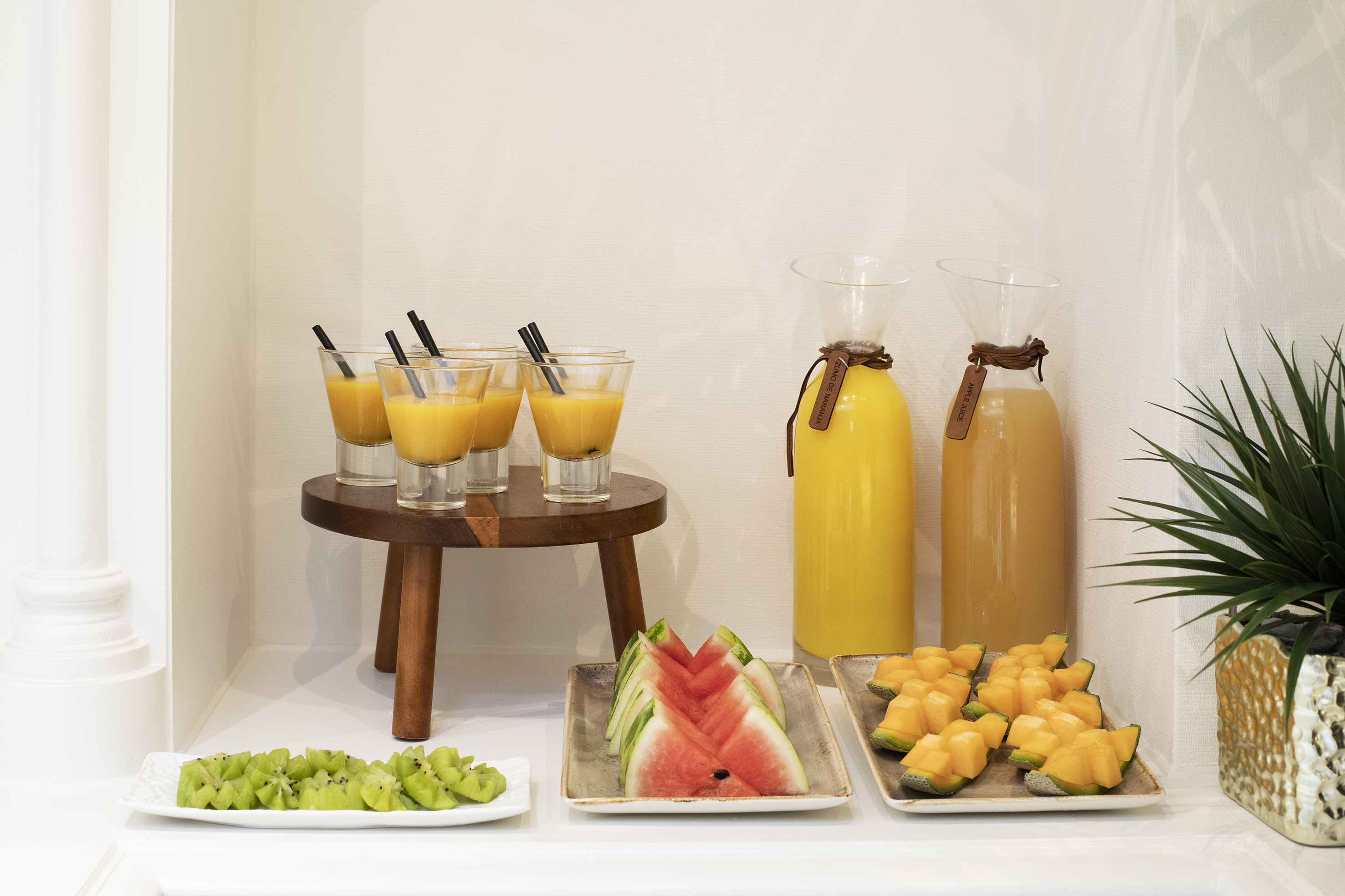 a table with fruit and juices