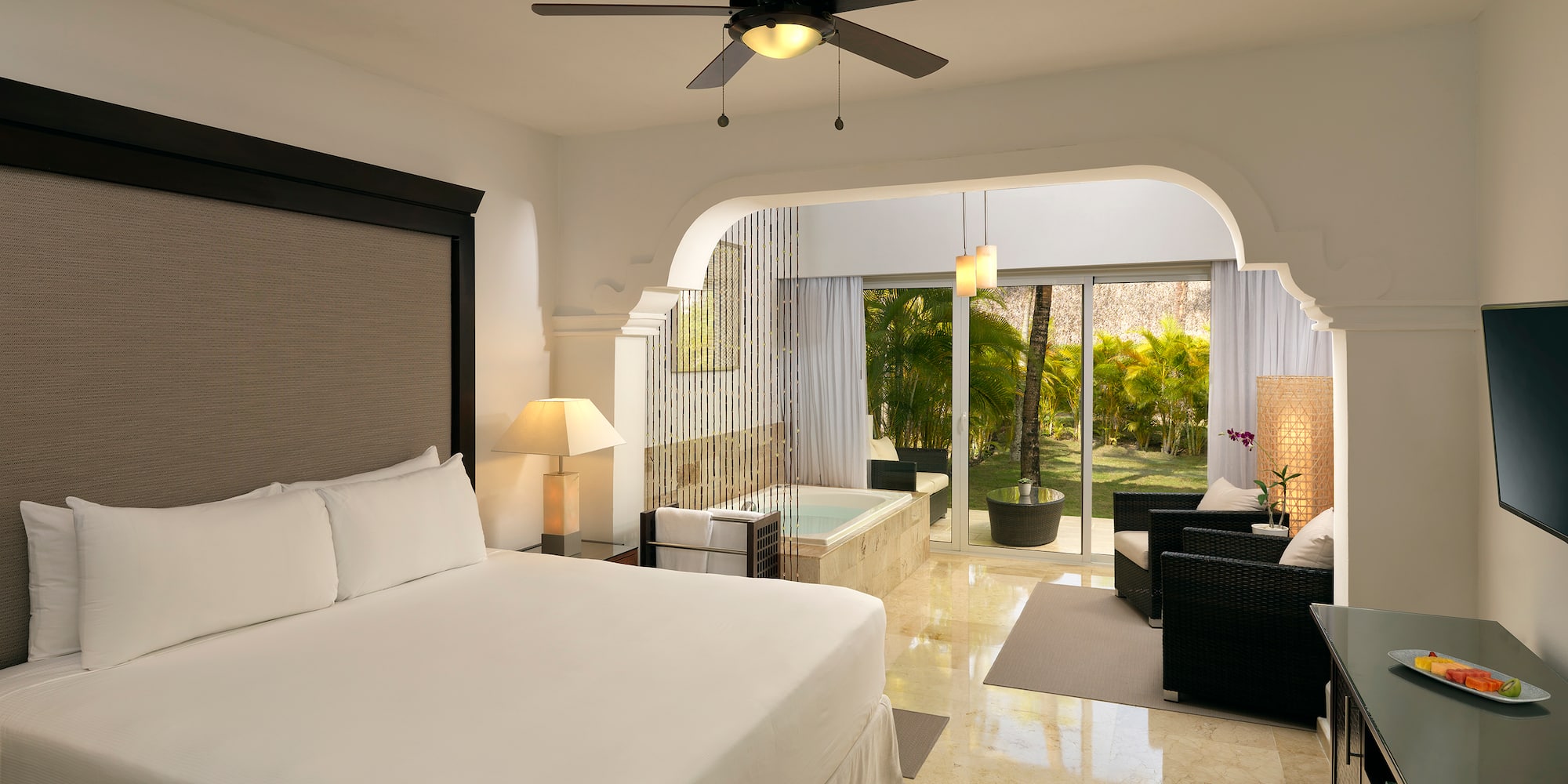 a room with a bed and a tub