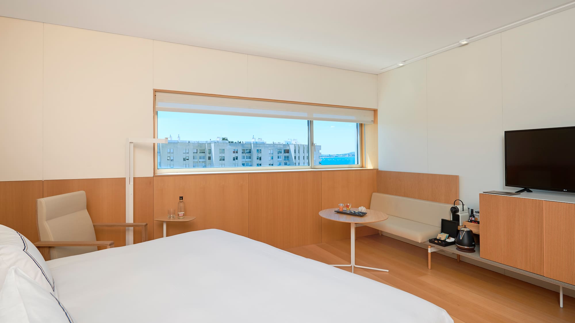 a room with a bed and a bench