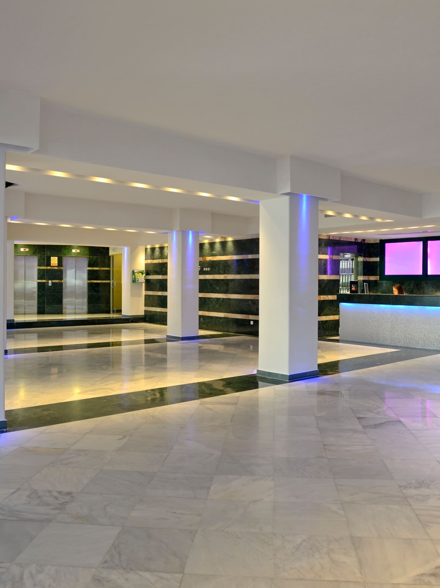 a large room with a large counter and a large mirror