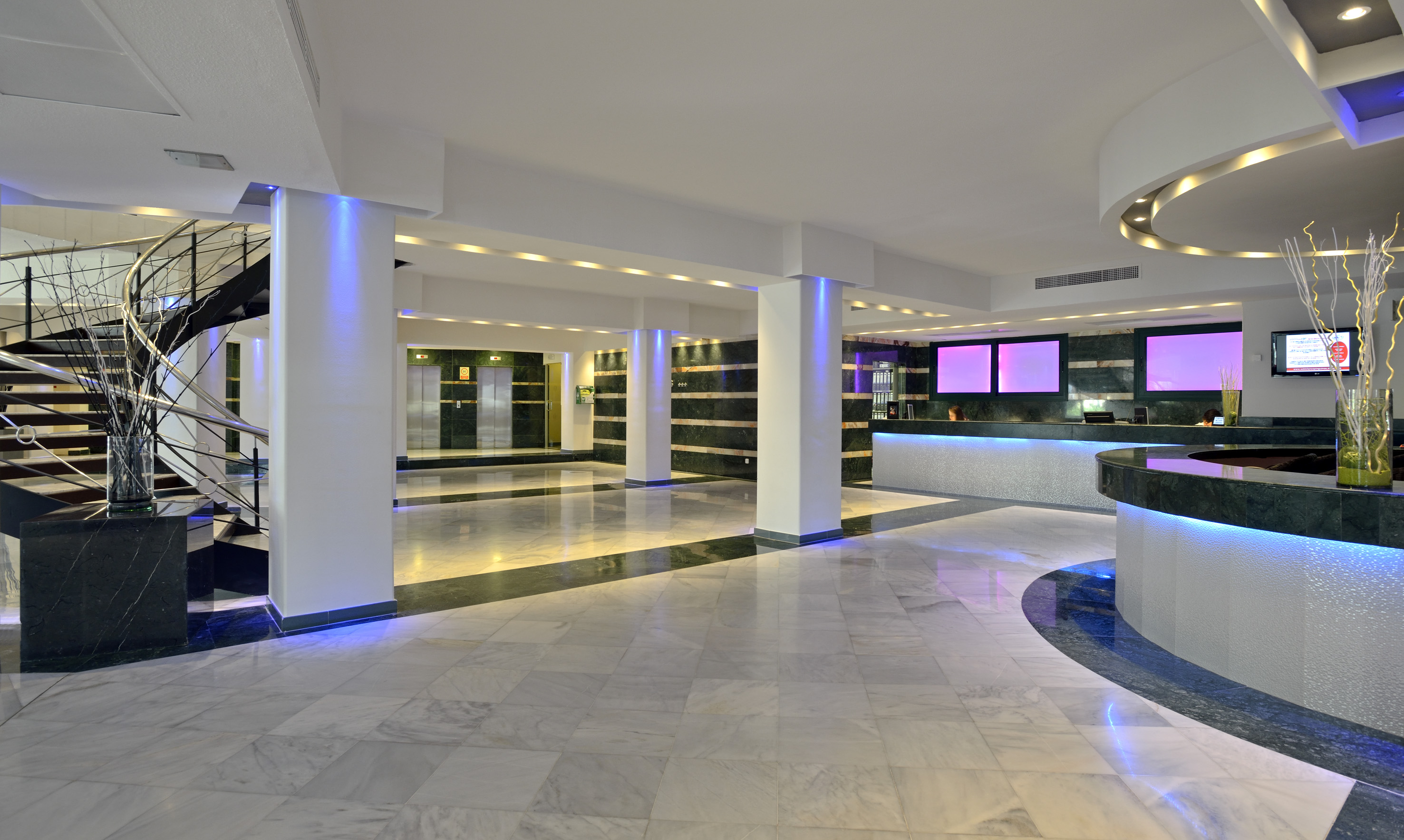 a large room with a large counter and a large mirror