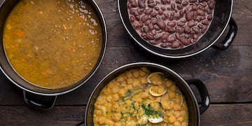 a group of bowls of soup and beans