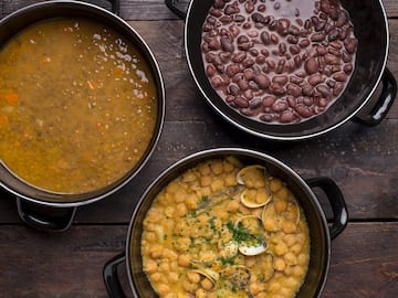 a group of bowls of soup and beans