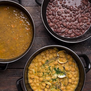 a group of bowls of soup and beans