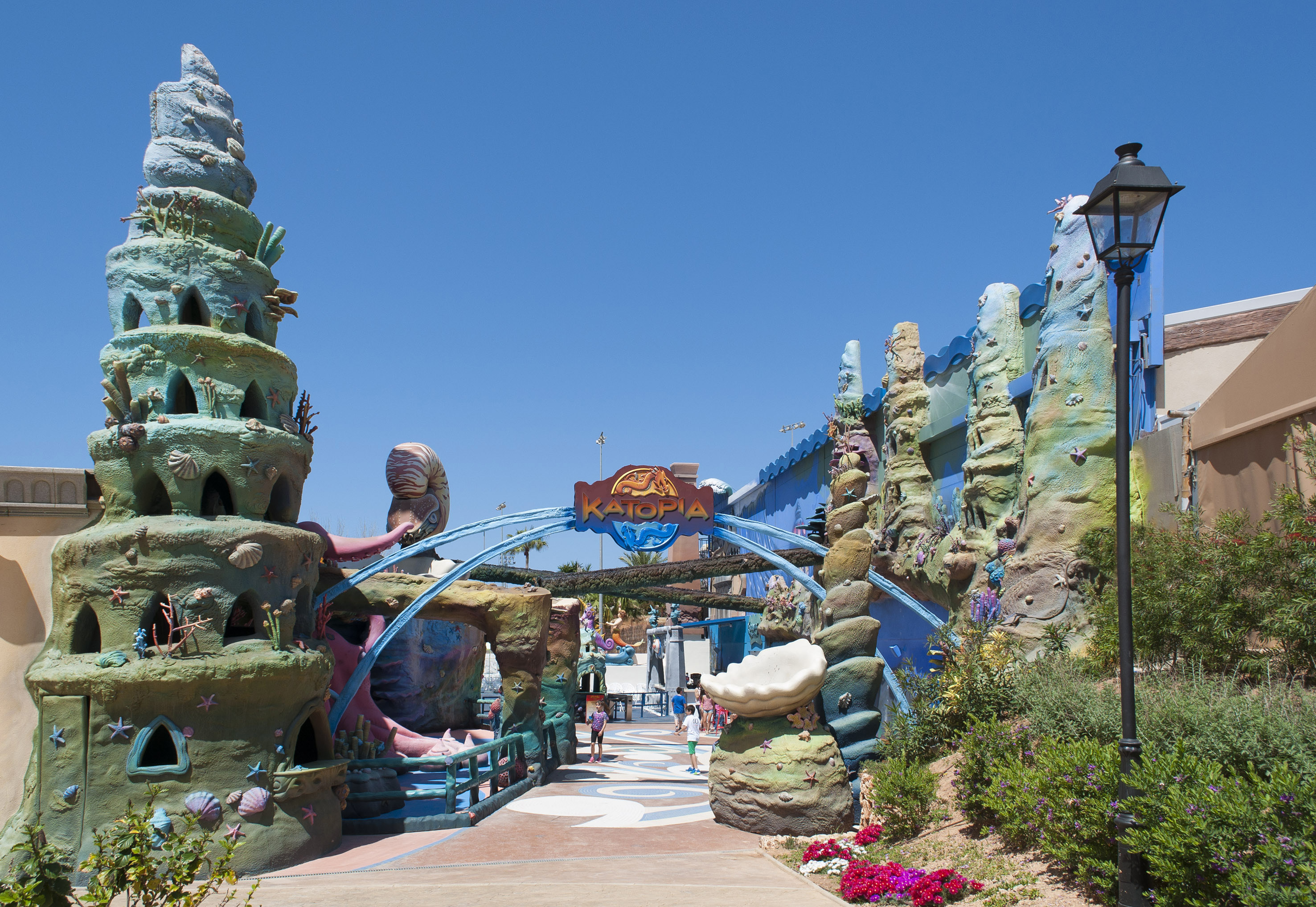 Katopia marine park entrance, colorful coral structures, shells, and kids.