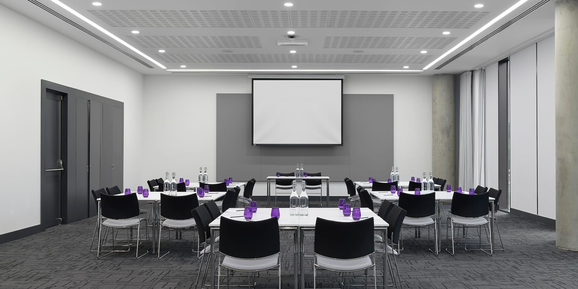 a room with a large screen