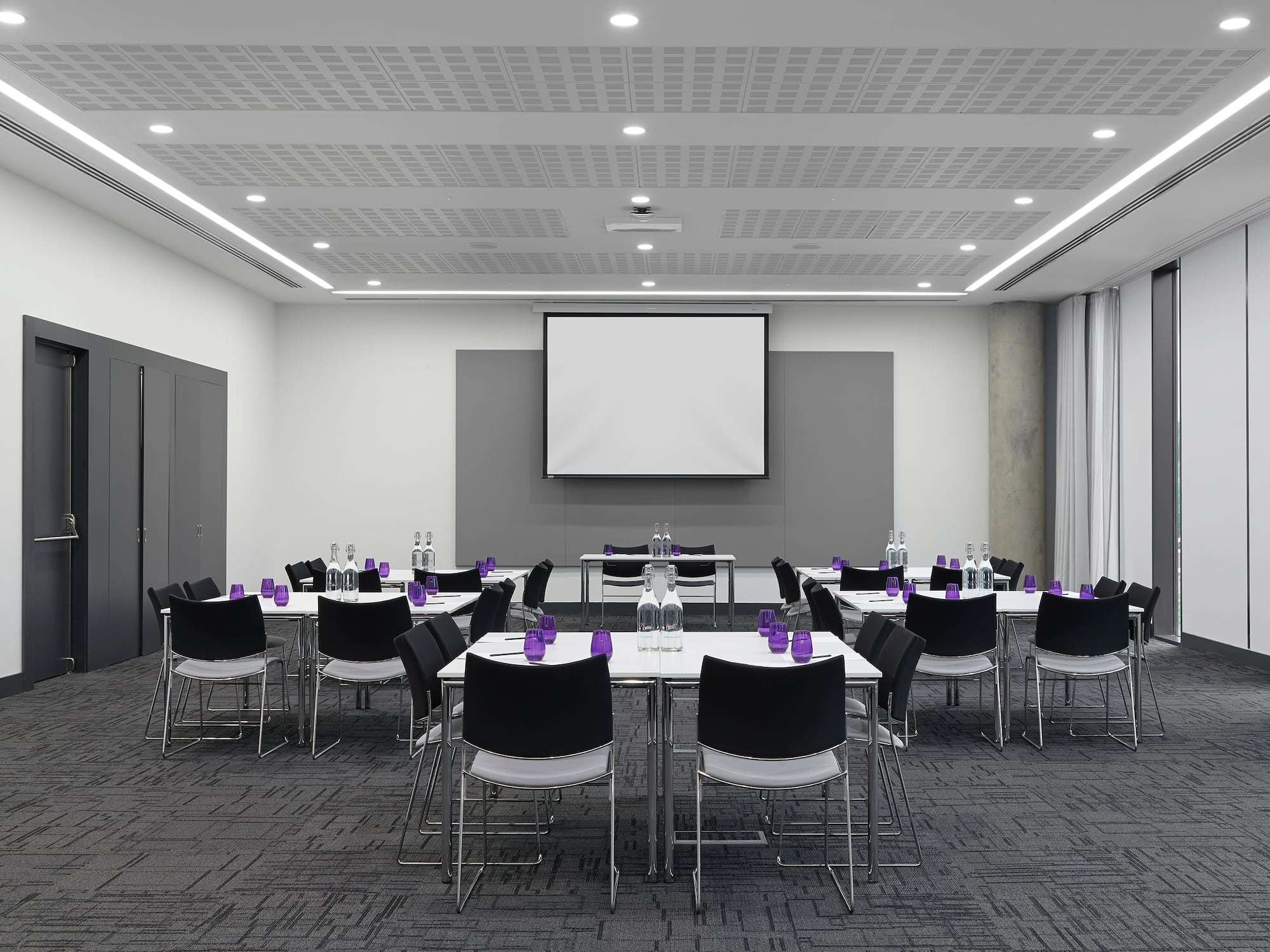 a room with a large screen