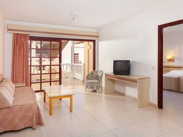 a room with a television and a table