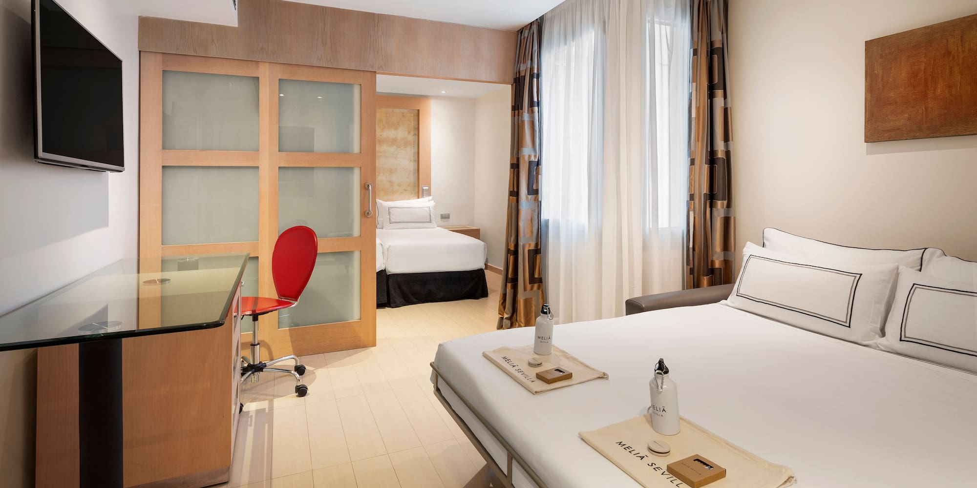 a room with a bed and a desk