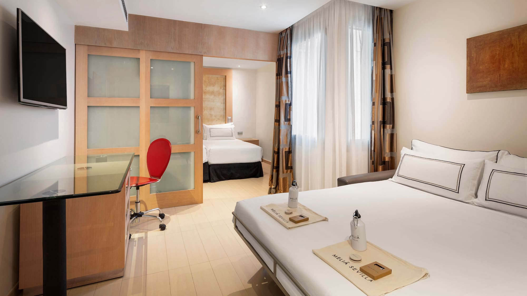 a room with a bed and a desk