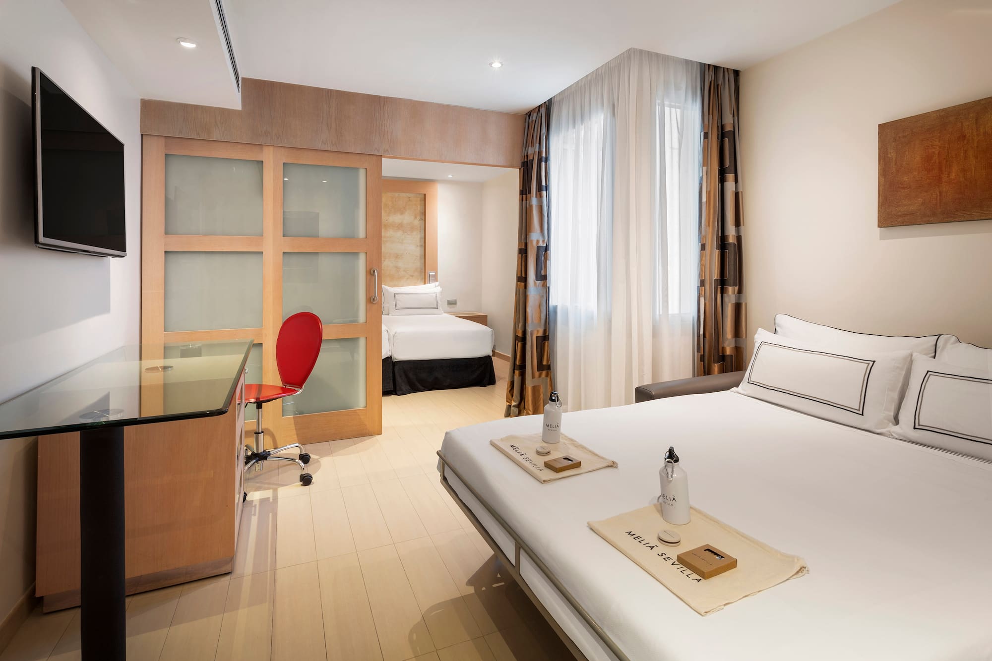 a room with a bed and a desk