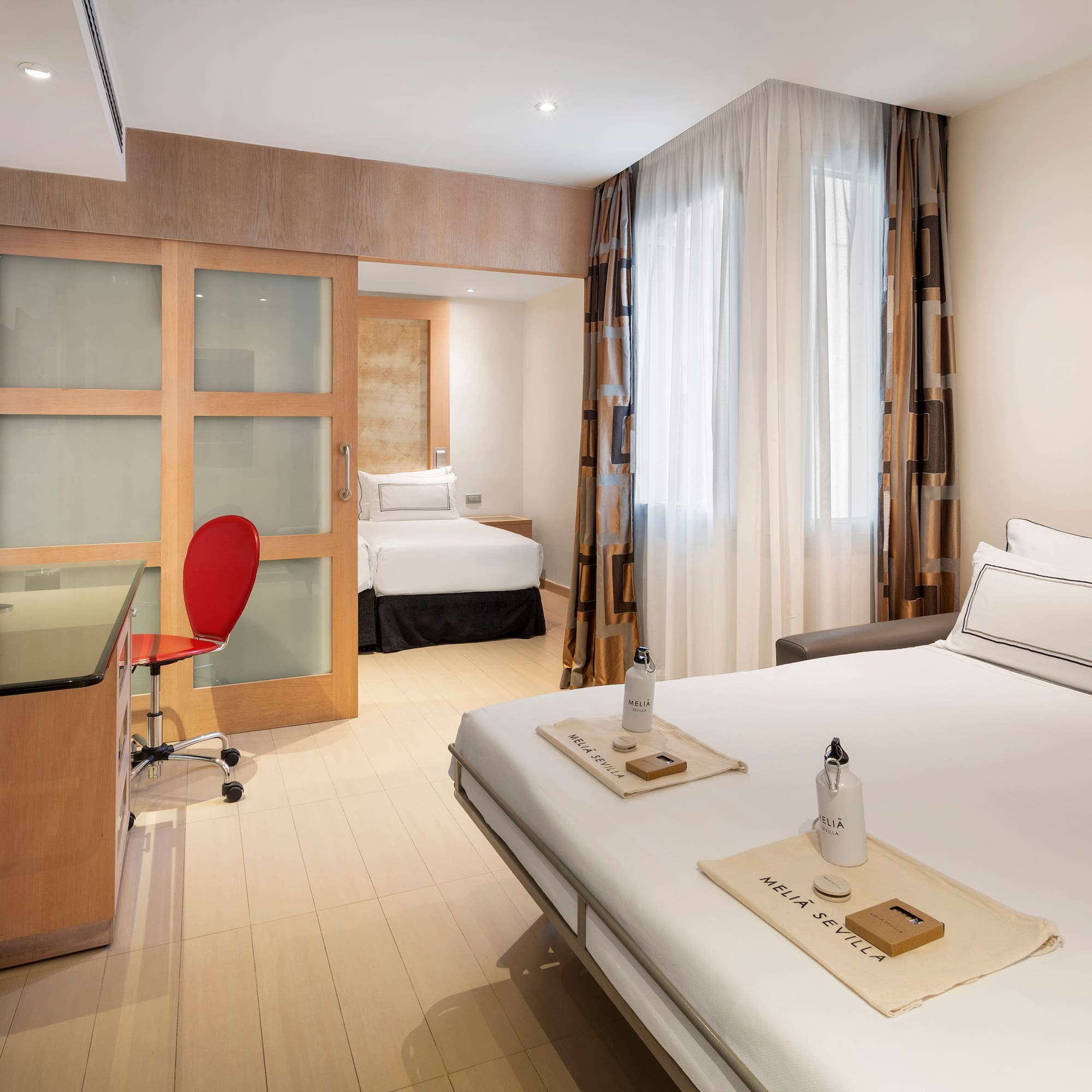 a room with a bed and a desk