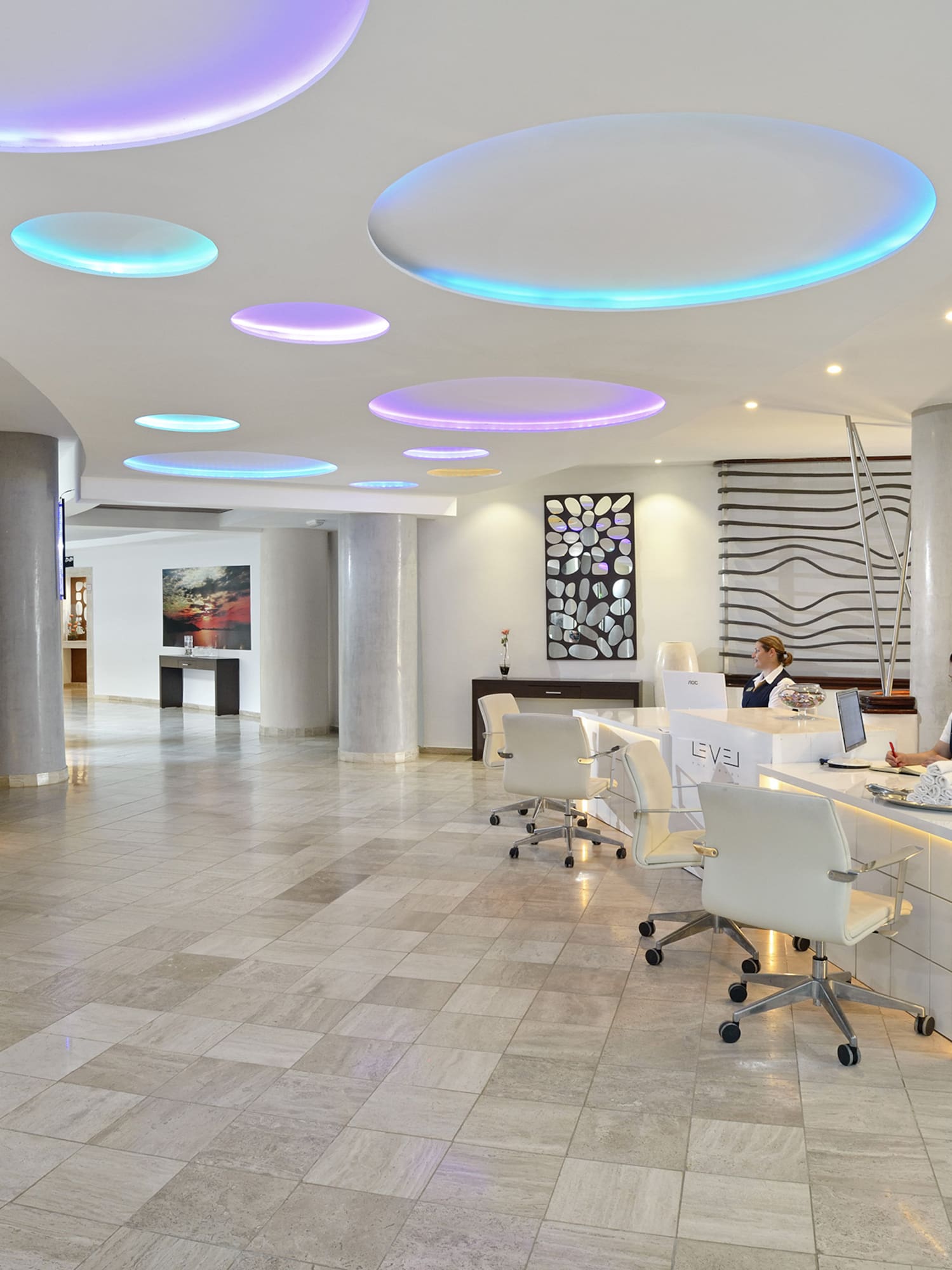 a group of people in a hotel lobby