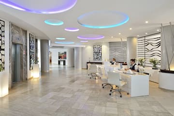 a group of people in a hotel lobby