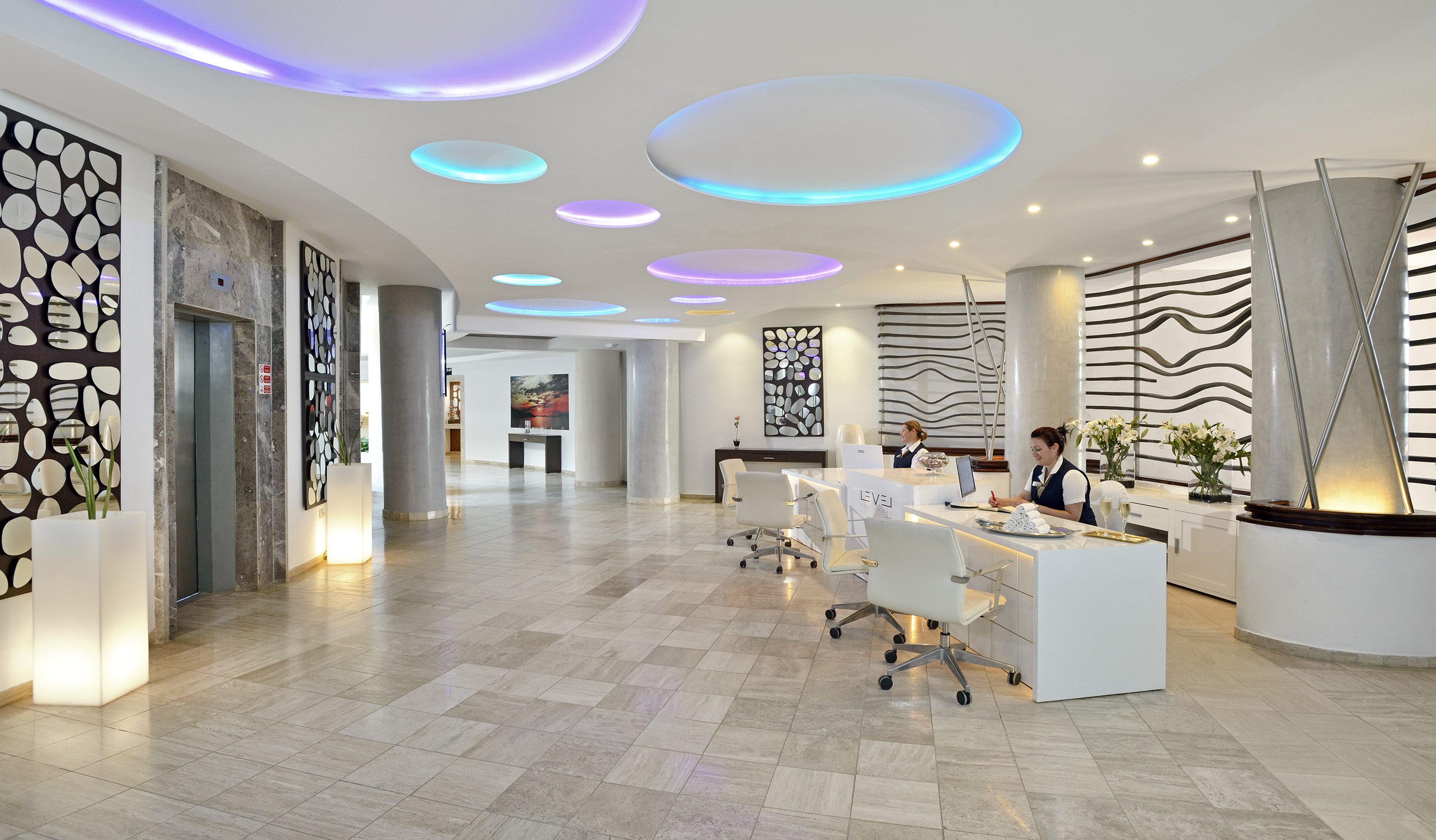 a group of people in a hotel lobby