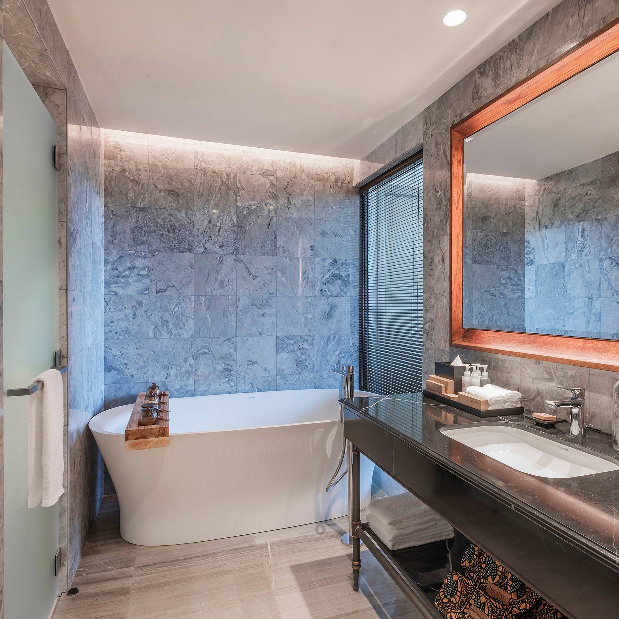 a bathroom with a tub and sink