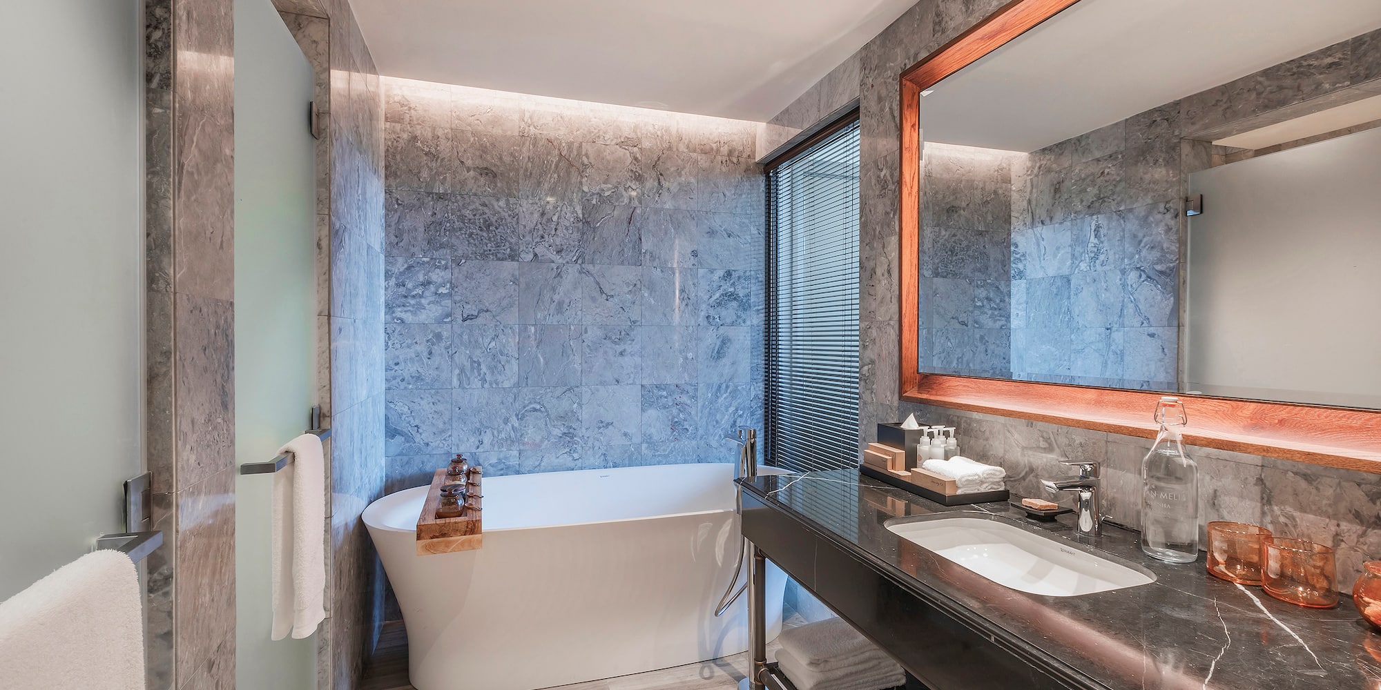 a bathroom with a tub and sink