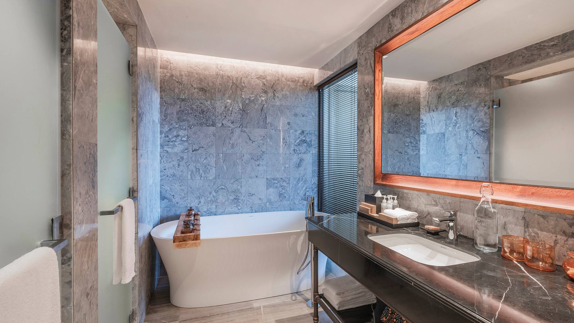 a bathroom with a tub and sink