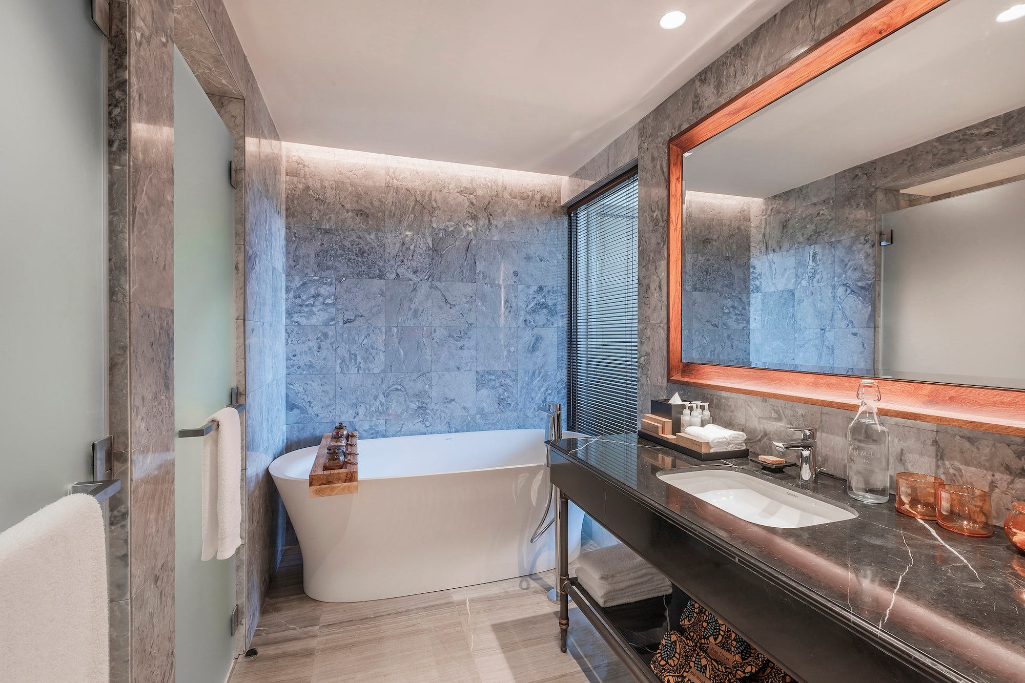 a bathroom with a tub and sink